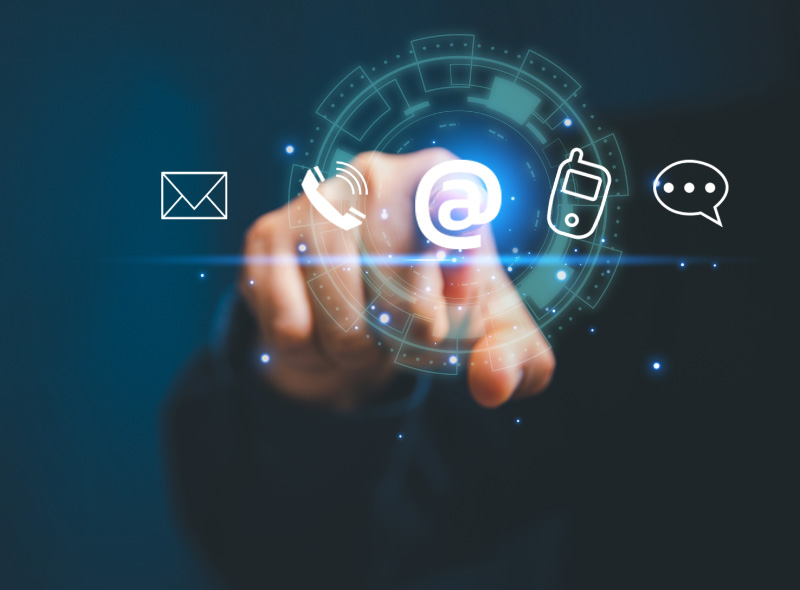 Hand touching a digital contact and communication icon